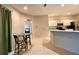 Bright eat-in kitchen features stainless steel appliances, white cabinetry, and a breakfast bar for casual dining at 15702 Sw 16Th Avenue Rd, Ocala, FL 34473