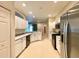 Bright kitchen features white cabinets, stainless appliances, and a layout that connects to other living spaces at 15702 Sw 16Th Avenue Rd, Ocala, FL 34473