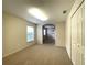 Bright carpeted living room with natural light, featuring neutral walls and ample closet space at 15702 Sw 16Th Avenue Rd, Ocala, FL 34473