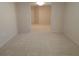 Neutral living room with plush carpeting and an open archway leading to other rooms at 15702 Sw 16Th Avenue Rd, Ocala, FL 34473