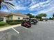 A row of golf carts parked in a well-maintained parking lot, ready for a round of golf at 15702 Sw 16Th Avenue Rd, Ocala, FL 34473