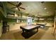 A recreation room features pool tables, seating, and ample space for entertainment at 15702 Sw 16Th Avenue Rd, Ocala, FL 34473
