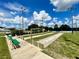 Shuffleboard courts with benches are available for recreation on a sunny day at 15702 Sw 16Th Avenue Rd, Ocala, FL 34473