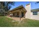 Relaxing covered back porch with outdoor seating, perfect for enjoying the fresh air at 1732 Se 38Th Ct, Ocala, FL 34471
