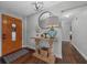 Welcoming foyer with dark wood floors, a stylish table, and decorative accents at 1732 Se 38Th Ct, Ocala, FL 34471
