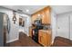 This view shows kitchen with appliances, wooden cabinets, granite countertops, and access to the laundry room at 1732 Se 38Th Ct, Ocala, FL 34471