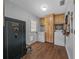 Well-equipped laundry room featuring wood-look tile floors and ample cabinet space at 1732 Se 38Th Ct, Ocala, FL 34471