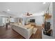 Spacious living room featuring hardwood floors, a fireplace, and modern furnishings for comfortable living and entertaining at 1732 Se 38Th Ct, Ocala, FL 34471