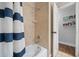 Shower with tiled walls, a shower head, and a view into the next room at 1732 Se 38Th Ct, Ocala, FL 34471