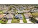Birds eye view of home and community featuring mature trees and landscaped yards at 1854 Oxford Lane, The Villages, FL 32162