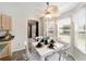 Charming breakfast nook with a white table, natural light and close proximity to kitchen at 1854 Oxford Lane, The Villages, FL 32162