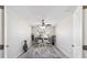 Cozy office space with fan, bright window, and stylish gray rug at 1854 Oxford Lane, The Villages, FL 32162