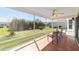 Screened porch area overlooking the backyard and landscaping at 1854 Oxford Lane, The Villages, FL 32162