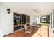 Enclosed porch with views of backyard, perfect for relaxing or entertaining guests at 1854 Oxford Lane, The Villages, FL 32162