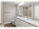 Bathroom featuring double sinks, granite countertops, and a tile shower at 2 Hemlock Ter Dr, Ocala, FL 34472