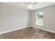 Bright bedroom with hardwood floors, a ceiling fan, and a sunlit window at 2 Hemlock Ter Dr, Ocala, FL 34472