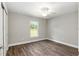 Bright bedroom with hardwood floors, a ceiling fan, and a sunlit window at 2 Hemlock Ter Dr, Ocala, FL 34472