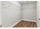 Walk-in closet featuring wood floors and wire shelving at 2 Hemlock Ter Dr, Ocala, FL 34472