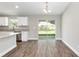 Dining area with sliding glass doors leading to the backyard, offering plenty of natural light at 2 Hemlock Ter Dr, Ocala, FL 34472
