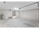 Clean, empty, freshly painted two car garage with water heater, access door and hook-ups at 2 Hemlock Ter Dr, Ocala, FL 34472