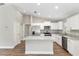 Modern kitchen with stainless steel appliances, granite countertops, and a center island at 2 Hemlock Ter Dr, Ocala, FL 34472