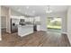 Bright, open kitchen featuring stainless appliances, granite countertops, and a center island at 2 Hemlock Ter Dr, Ocala, FL 34472