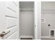 Laundry room with washer/dryer hookups and overhead shelving for organized storage at 2 Hemlock Ter Dr, Ocala, FL 34472