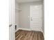 Mud room with wood-look flooring and built-in shelving for organized storage at 2 Hemlock Ter Dr, Ocala, FL 34472