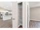 Pantry with metal shelving offers ample space; open floorplan in background at 2 Hemlock Ter Dr, Ocala, FL 34472