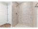 Walk-in shower featuring tile walls and floors, and a shower head at 2 Hemlock Ter Dr, Ocala, FL 34472