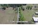 An aerial view of 17,500 ft. of paved driveway leading to a property amidst a green landscape at 2061 Nw 165Th Court Rd, Dunnellon, FL 34432