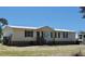 An eye-level view of the front of the home showcasing its well-kept facade and design at 2061 Nw 165Th Court Rd, Dunnellon, FL 34432
