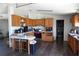 Bright kitchen with wooden cabinets, modern appliances, and a cozy breakfast bar, blending style with functionality at 2061 Nw 165Th Court Rd, Dunnellon, FL 34432
