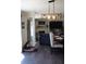 Open-concept living room and kitchen featuring a large dining table with seating for eight and a fireplace at 2061 Nw 165Th Court Rd, Dunnellon, FL 34432