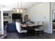 Combined living and dining room with hardwood floors, fireplace, and TV at 2061 Nw 165Th Court Rd, Dunnellon, FL 34432