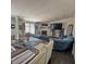 Living room featuring hardwood floors, an electric fireplace, and comfortable seating at 2061 Nw 165Th Court Rd, Dunnellon, FL 34432