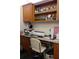 Functional office space with built-in wooden cabinets and a comfortable chair for productivity at 2061 Nw 165Th Court Rd, Dunnellon, FL 34432