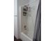 Standard white shower/tub with a grey shower curtain for added privacy and style at 2061 Nw 165Th Court Rd, Dunnellon, FL 34432
