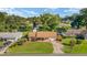 An aerial shot showcasing a home with a spacious yard in a tranquil, tree-lined neighborhood at 22 Banyan Dr, Ocala, FL 34472