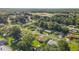 This shot captures the beauty of a residential neighborhood, surrounded by mature trees and lush greenery at 22 Banyan Dr, Ocala, FL 34472