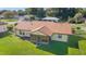 Well-maintained home featuring a screened-in porch and a spacious, green backyard at 22 Banyan Dr, Ocala, FL 34472