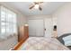 Bedroom features a bed, ceiling fan, dresser, window, and closet at 22 Banyan Dr, Ocala, FL 34472
