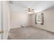 Inviting bedroom with neutral carpet, ceiling fan, and natural light from the window at 22 Banyan Dr, Ocala, FL 34472