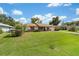 Charming single-story home featuring a well-manicured lawn and classic curb appeal at 22 Banyan Dr, Ocala, FL 34472