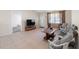 Bright living room with tile floors and natural light from the front door and window at 22 Banyan Dr, Ocala, FL 34472