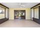 Sunroom features sliding glass doors, a ceiling fan, and outdoor views for a comfortable relaxation space at 22 Banyan Dr, Ocala, FL 34472