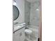 Bathroom features a shower and bath combo with marble tiling, sink, and granite countertop at 3 Dogwood Drive Loop, Ocala, FL 34472