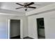 Spacious bedroom with a closet, ceiling fan and an ensuite bathroom at 3 Dogwood Drive Loop, Ocala, FL 34472