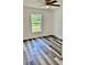 Bedroom featuring a window, ceiling fan, and stylish laminate flooring at 3 Dogwood Drive Loop, Ocala, FL 34472