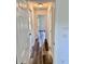 Bright hallway with laminate flooring and access to other rooms in the house at 3 Dogwood Drive Loop, Ocala, FL 34472